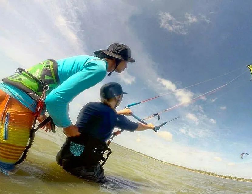 A Valampuri instructor coaching a student in the water at Kalpitiya