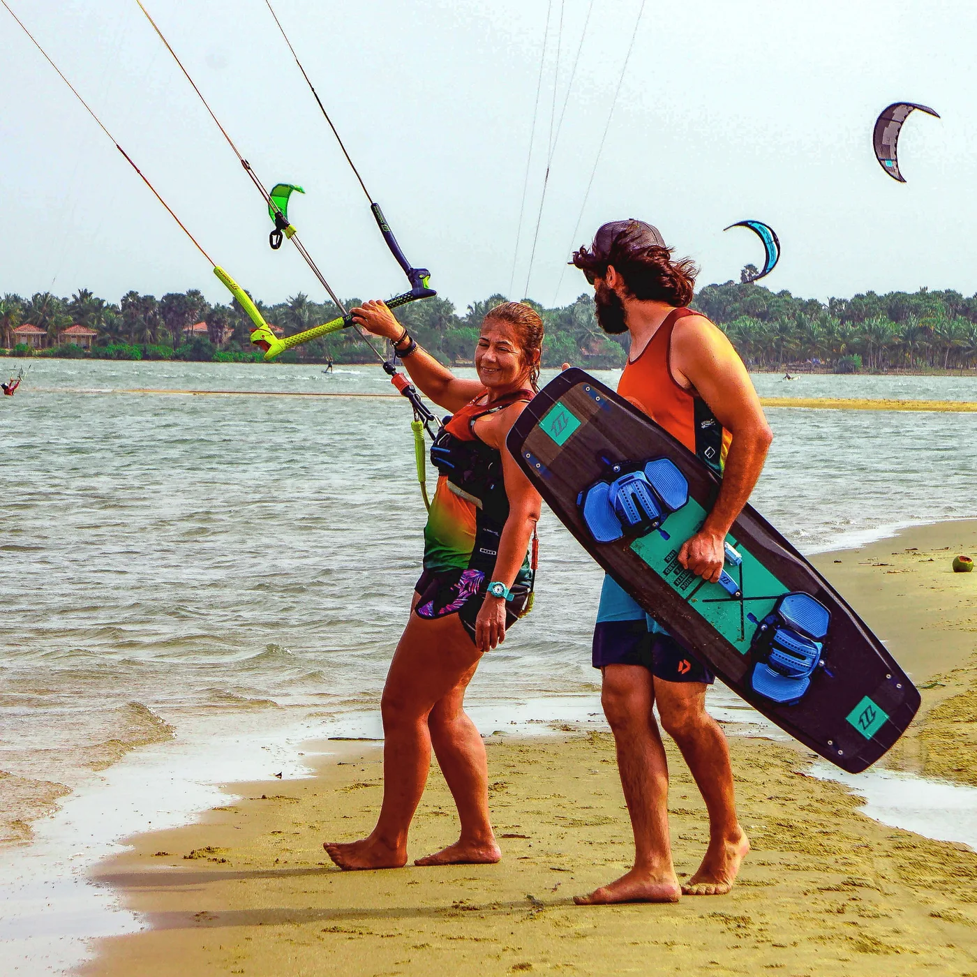 IKO-certified Valampuri instructor with a rider and board on the beach
